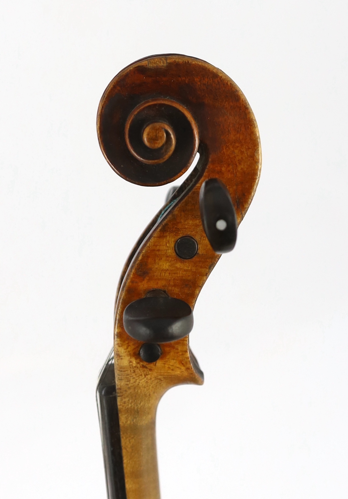 An 18th century violin, labelled ‘New Back by James Carroll, Maker, Manchester 1899’, length of back 36.5cm